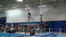 Alyssa Kaschak  State Bars Champion flies through a pak salto