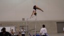 Nicolette McNair in a jam handstand on bars