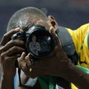 Not Impressed by Usain Bolt taking a photo of me with a fancy camera 760 views