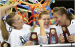 Mackenzie Caquatto, Bridget Sloan, and Dali Lemezan with their Champion Trophies